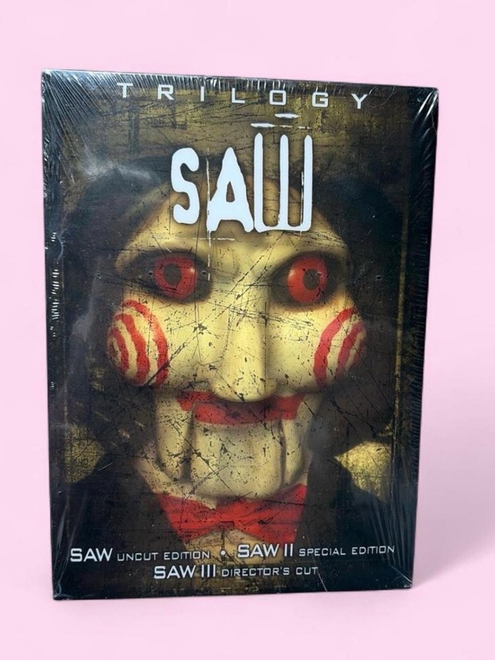 Saw trilogy collectors edition with 3D Jigsaw, contains 3 movies